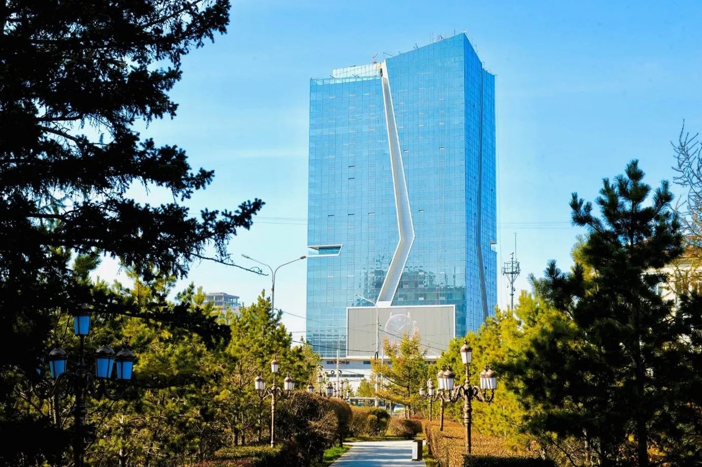 ECO-25's blue glass façade with its signature white ribbon feature